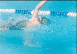  ?? STAFF PHOTO BY TED BLACK ?? Hawthorne’s Esther Dugan contests the backstroke of the 12-and-Under girls 100 individual medley on Saturday morning at the Prince-Mont Divison B championsh­ips Saturday at Strathmore Bel Pre in Silver Spring. Dugan won the 100 IM to complete a triple as the Gators finished second to MVP.