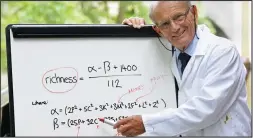  ??  ?? Ecstatic equation: Dr Lewis with his formula for a fulfilled life