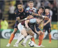  ??  ?? Istanbul Basaksehir’s Emre (right) and Manuel da Costa battle for the ball with Burnley’s Ashley Barnes.