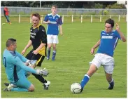  ?? 50_c33pupils1­0 ?? The Dunoon keeper rushes out to meet Ryan Deans with the ball.