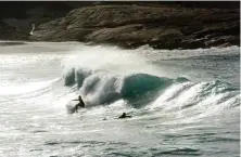  ??  ?? Huge swells from the Southern Ocean break on the mainland’s Twilight Beach, making this one of Australia’s legendary surfing locations.