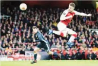  ??  ?? Arsenal’s Aaron Ramsey scores one of his two goals against CSKA Moscow in a Europa League on Thursday.