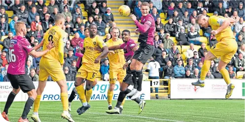  ??  ?? Livingston captain Alan Lithgow opens the scoring with a header from Aymen Souda’s corner