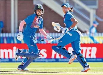  ??  ?? LEFT
India’s Shafali Verma, left, and Harmanpree­t Kaur in action against Sri Lanka.
