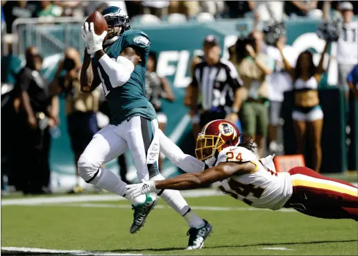 ?? MICHAEL PEREZ — THE ASSOCIATED PRESS ?? The ability of receiver DeSean Jackson, here eluding Washington corner back Josh Norman and hauling in a pass, to stretch opposing defenses has added a new, vertical dimension to the Eagles’ offense.