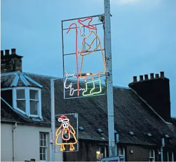  ??  ?? SPECIAL TOUCHES: Newburgh children added some animal magic to the festive lights.