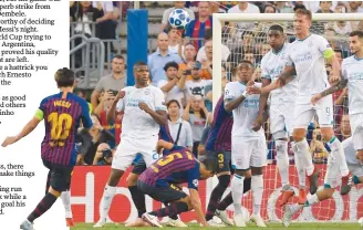  ??  ?? Barcelona’s Lionel Messi scores a beauty from a freekick during the Champions’ League Group B match against PSV Eindhoven at the Nou Camp stadium yesterday. –