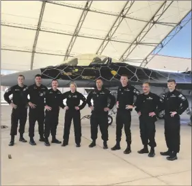  ?? ELIZABETH MAYORAL CORPUS PHOTO ?? The F-16 Viper Demo Team lined up in front of a Viper aircraft on Thursday, March 9, days before the 52nd Air Show at Naval Air Facility El Centro.