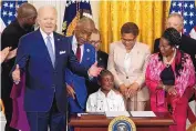  ?? ALEX BRANDON/ASSOCIATED PRESS ?? President Joe Biden speaks as Gianna Floyd, the daughter of George Floyd, sits in the chair after Biden signed an executive order targeting policing on Wednesday.