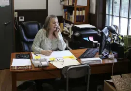  ?? Wilson Ring, The Associated Press ?? Town Clerk Tracey Martel takes a phone call at the town clerk’s office, in Victory, Vt., on March 31.