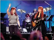  ?? JULIE JACOBSON / AP FILE ?? Naomi Judd, left, and Wynonna Judd, of The Judds, play at “Girls’ Night Out: Superstar Women of Country,” in Las Vegas in 2011.