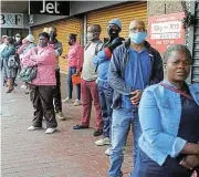  ?? /Mkhuseli Sizani/Ground Up ?? No work: Jobless people queue for unemployme­nt relief at the labour department’s Gqeberha offices.