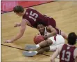  ?? DARRON CUMMINGS - THE ASSOCIATED PRESS ?? Arkansas’ JD Notae (1) and Colgate’s Tucker Richardson (15) battle for a loose ball during the first half of a first round game at Bankers Life Fieldhouse in the NCAA men’s college basketball tournament, Friday, March 19, 2021, in Indianapol­is.