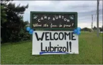  ?? BILL DEBUS — THE NEWS-HERALD ?? A sign at Camp Burton in Burton Township is decorated to welcome Lubrizol Corp. employees on June 7 for the company’s annual Building Bonds volunteer event.