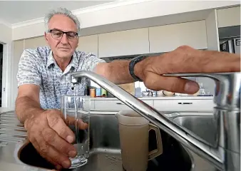  ?? MARTIN DE RUYTER/ STUFF ?? Tasman District Council engineerin­g services manager Richard Kirby has implemente­d water-saving measures at his own home in Richmond.