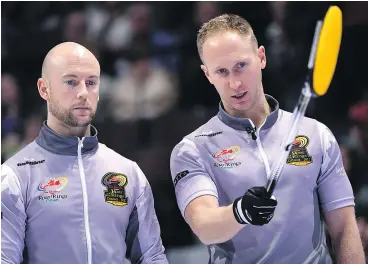  ?? — CP FILES ?? Ryan Fry, left, will rejoin skip Brad Jacobs for next week’s Grand Slam of Curling’s Canadian Open. It will be his first action with the team since last Nov. 11.