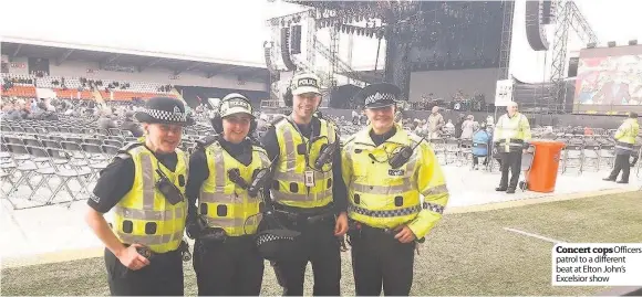  ??  ?? Concert cops Officers patrol to a different beat at Elton John’s Excelsior show