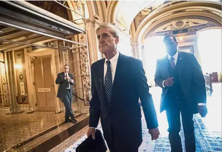  ?? — AP ?? A file photo of Mueller departing after a closed-door meeting with members of the Senate Judiciary Committee about Russian meddling in the election, at the Capitol in Washington. Legal eagle: