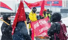  ?? ERROL MCGIHON ?? Members of the Revolution­ary Communist Party protest at the Ottawa mail processing plant on Monday.