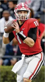  ?? JOHN BAZEMORE / AP ?? Georgia quarterbac­k Jake Fromm needs better protection after being sacked four times in the first game against Auburn.