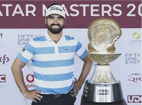  ??  ?? 0 Antoine Rozner of France poses with the trophy after his victory in the Commercial Bank Qatar Masters at Education City Golf Club