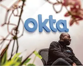  ?? Jessica Christian/The Chronicle 2018 ?? A security official mans the front desk of Okta’s office in San Francisco. The password and log-in security company said it would cut about 300 employees.