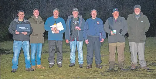  ??  ?? Alan Brown winner of the J E Jacobson Trophy with the other high guns. Left to right: John Docherty, Leighton Reid, David Mundell, Alan Brown, Derek Street, Tam Young and Ted Blakeway.