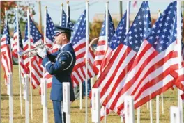  ?? FILE PHOTO ?? Senior Airman Austin Dischert plays taps during a Veterans Day ceremony at the Jacksonvil­le Museum of Military History in 2010. This year’s celebratio­n will feature a concert by the Jacksonvil­le High School Choir.