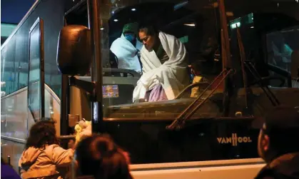  ?? Photograph: Bastiaan Slabbers/Reuters ?? Migrants transporte­d from the US border arrive on a bus from Texas and are taken by city officials to wait for relocation, in Philadelph­ia, Pennsylvan­ia, on Wednesday.