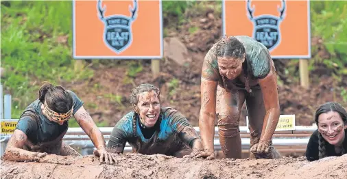  ?? Photograph­s by Kenny Elrick ?? MUD, GLORIOUS MUD: Women were in the majority at this year’s Beast Race outside Banchory.