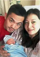  ??  ?? Happy together: Lin Dan with Xie after the birth of their son.
