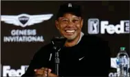 ?? (AP/Ryan Kang) ?? Tiger Woods will not compete in the Genesis Invitation­al — an event in which he is the tournament host — this weekend in Los Angeles as he’s still recovering from injuries suffered in a car accident in February 2021.