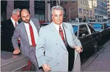  ?? [ASSOCIATED PRESS FILE PHOTO] ?? John Gotti, right, arrives at court, Feb. 9, 1990, in New York.