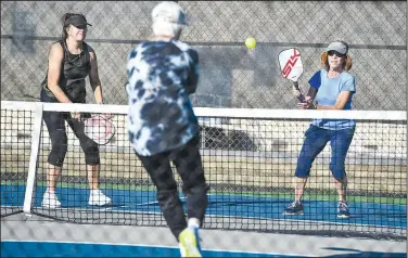  ?? (River Valley Democrat-Gazette/Hank Layton) ?? Becky Faldon (from right), Margaret Deuster, Amelia Hamm and others play pickleball Tuesday at the Chaffee Crossing Pickleball Complex in Barling. Sebastian County’s Quorum Court is set to consider a project to build pickleball courts at a former go-kart track site at Ben Geren Park in Fort Smith at its meeting Dec. 20. Go to nwaonline.com/221127Dail­y/ for today’s photo gallery.