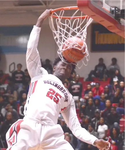  ?? | WORSOM ROBINSON/ FOR THE SUN- TIMES ?? Bolingbroo­k senior Nana Akenten slams down two of his 21 points Thursday against Lockport.