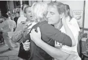  ?? MICHAEL LAUGHLIN/STAFF FILE PHOTO ?? Seiler hugs his wife Susan after winning his second term as mayor on Jan. 31, 2012.