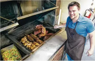  ?? J.C. Reid ?? Josh Scott took over as head pitmaster at Pizzitola’s Bar-B-Cue last year.