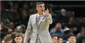  ?? NICK WASS — THE ASSOCIATED PRESS FILE ?? Villanova head coach Jay Wright gestures during the first half of an NCAA college basketball game against Georgetown in Washington, in this Saturday, March 7, 2020, file photo. Villanova coach Jay Wright was set to return to practice Tuesday following his bout with COVID-19. Those plans are on hold after two players tested positive Monday, Jan. 4, 2021, and the Wildcats were forced to postpone their next three games.