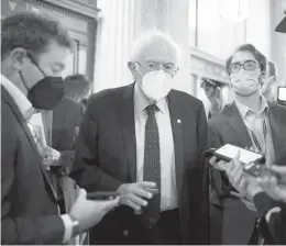  ?? AL DRAGO/THE NEW YORK TIMES ?? U.S. Sen. Bernie Sanders, I-Vt., seen talking to reporters Oct. 6, is very upset that the Democrats’“Build Back Better”package is stalled.