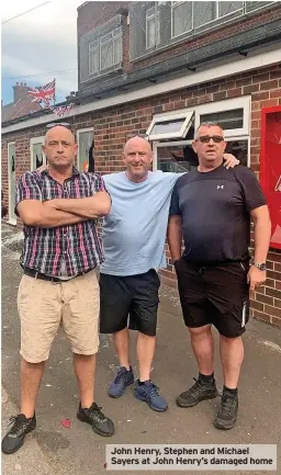  ?? ?? John Henry, Stephen and Michael Sayers at John Henry’s damaged home