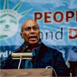  ?? PHOTOS BY ERIN CLARK/GLOBE STAFF ?? Former Massachuse­tts governor Deval Patrick (above) was among the speakers at a rally in Concord marking three years since the attack on the Capitol.