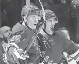  ?? BRUCE BENNETT/GETTY IMAGES ?? Kaapo Kakko (24) and Erik Gustafsson of the Rangers celebrate Kakko’s second-period goal against the Dallas Stars at Madison Square Garden on Tuesday in New York City.