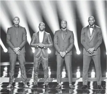  ?? KEVIN WINTER, GETTY IMAGES ?? NBA stars, from left, Carmelo Anthony, Chris Paul, Dwyane Wade and LeBron James appear Wednesday at the ESPY Awards. “We all have to do better,” James said.