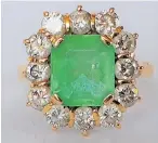  ?? ?? An emerald and diamond dress ring - Estimated at £2,000 to £3,000