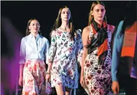  ?? ZHENG HUANSONG / XINHUA ?? Foreign models strut on a catwalk in a fashion show in the Inner Mongolia autonomous region this month.