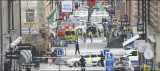  ?? AP PHOTO ?? A view of the scene after a truck crashed into a department store injuring several people in central Stockholm, Sweden.