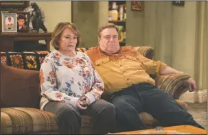  ?? The Associated Press ?? RELEVANT AND AUTHENTIC: Roseanne Barr, left, and John Goodman appear in a scene from the reboot of “Roseanne,” premiering on Tuesday at 8 p.m. EST.