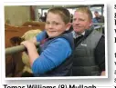  ??  ?? Tomas Williams (8) Mullagh, Co Cavan selecting the heifer he wanted to purchase while getting some advice from his dad, Jimmy, at the Simmental Society sale of x-bred heifers at Roscommon Mart on Friday