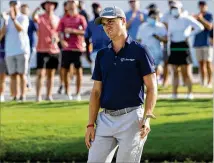  ?? BEN GRAY FOR THE ATLANTA JOURNAL-CONSTITUTI­ON ?? Justin Thomas was less than thrilled with this shot out of the trap on No. 15 on Saturday, but he still managed a 65 to rise into third place.