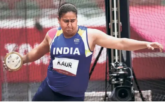  ?? AP ?? Keeping an eye:
Discus thrower Kamalpreet Kaur who qualified for the final of the Olympics and finished sixth, was tested out of competitio­ns before the Tokyo Games on two occasions. On both occasions her blood samples as well as samples for Biological Passport were also taken.